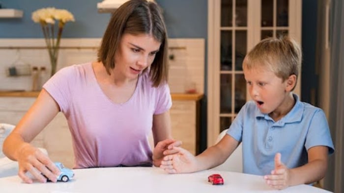 Parent teaching a child about safety through calm, hands-on play at home