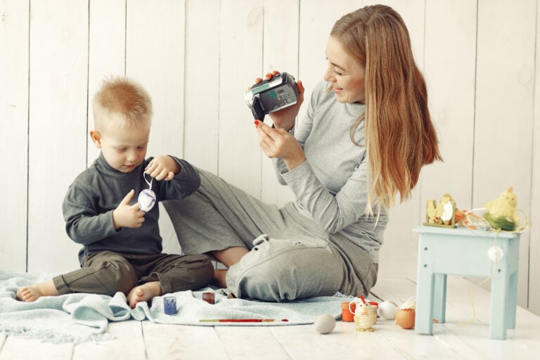 Babysitter doing fun activities with a young child